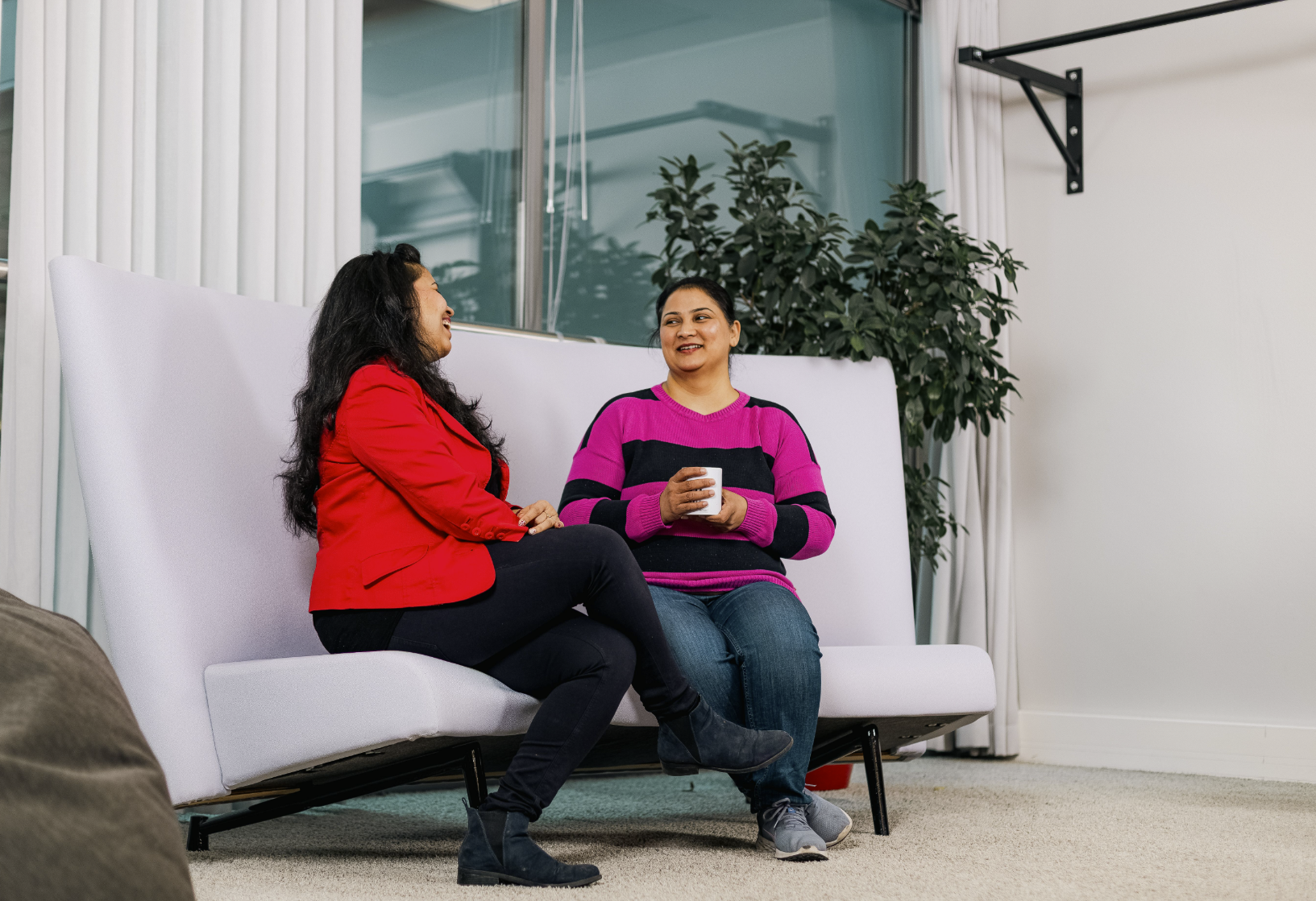 two Neomore employees sitting