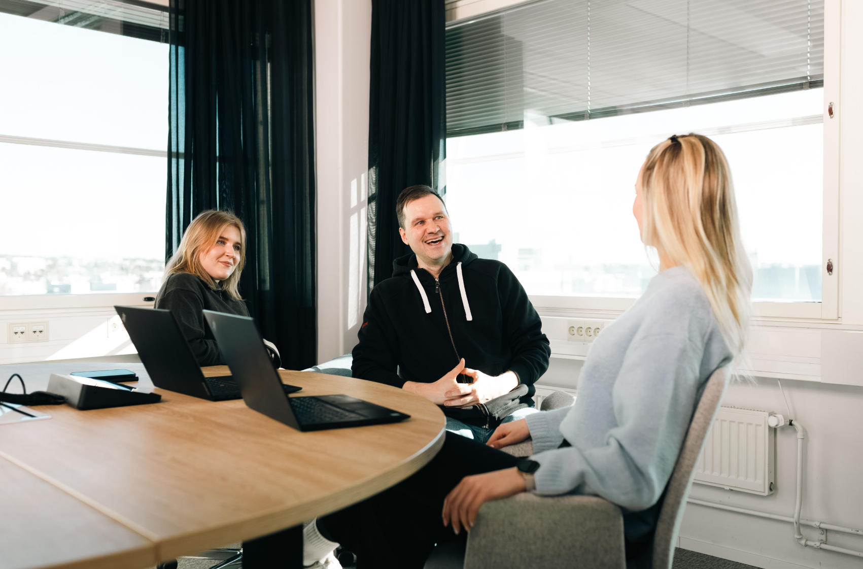 Neomore employees smiling