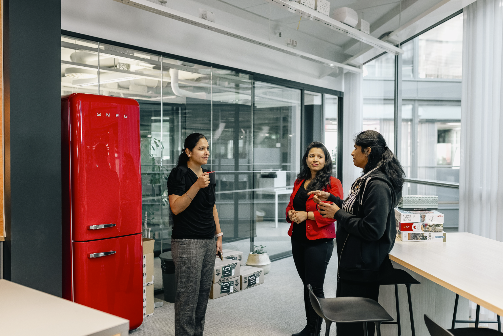 Neomore employees talking in a circle